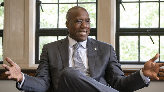 Image of President Wingard in an armchair, speaking.