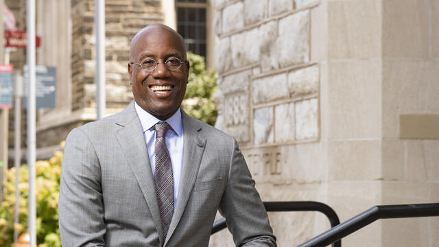 Temple President Jason Wingard posing outside.