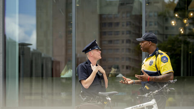 PPD and TUPD police officers talking outdoors