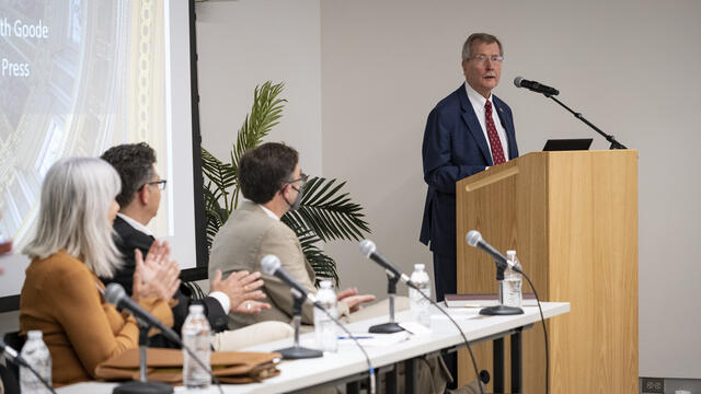 Richard Englert at a podium speaking during a Temple Press event.