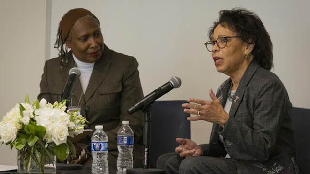 President Epps and Kimmika Williams-Witherspoon talking