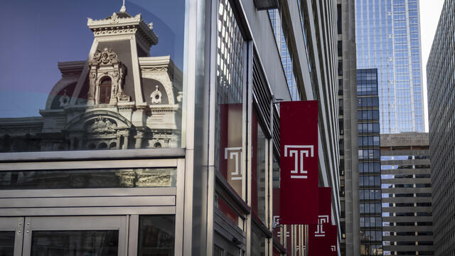 A picture of a Temple flag outside of Temple University Center City.