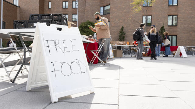 A sign at the World Food Day event reads FREE FOOD