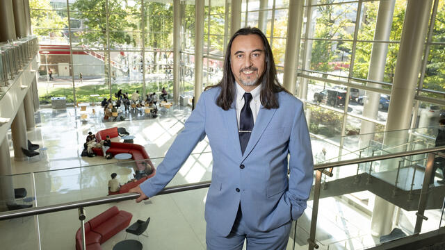 Dean Miguel Mostaf standing near the railing in the Science and Education Research Center