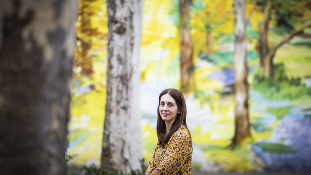 Liz Moore standing outside near trees