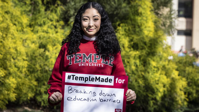 Evelyn Lara holding a Temple Made sign