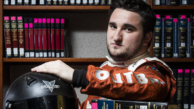 Image of a NASCAR driver inside Temple University s Law School.