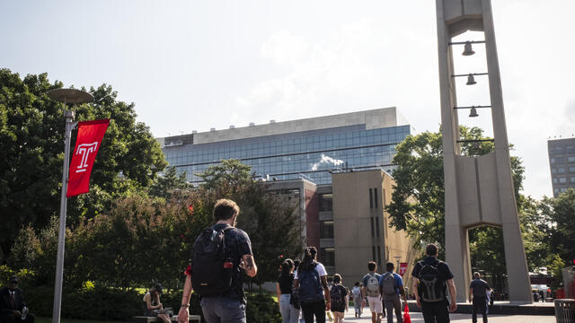Students walking by the bell tower