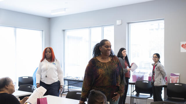 Image of a community health worker at Temple s breast cancer awareness event.