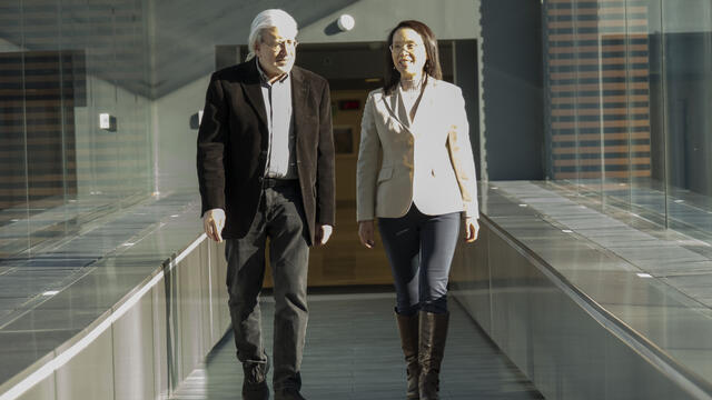 Steve Balsam ad Connie Mao walking in the Skybridge.