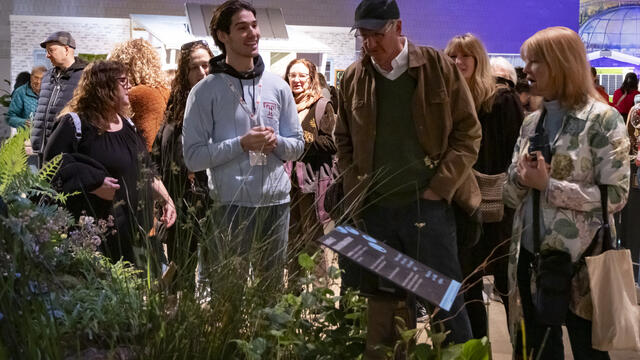A Temple student presenting the exhibit at the 2025 Philadelphia Flower Show