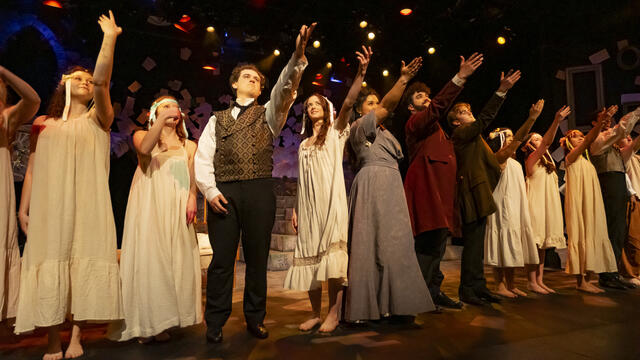 Image of the cast of Goblin Market performing on stage.