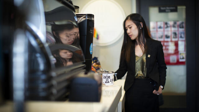 STHM faculty member Lu Lu pictured giving a tip.