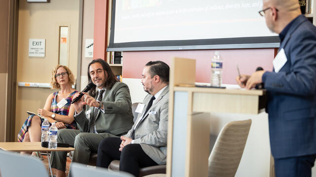 Miguel Mostaf , Mariola V. Alvarez and Michael Usino speaking in the Center for Anti-Racism