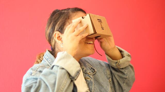 student looking through 360 video screening glasses