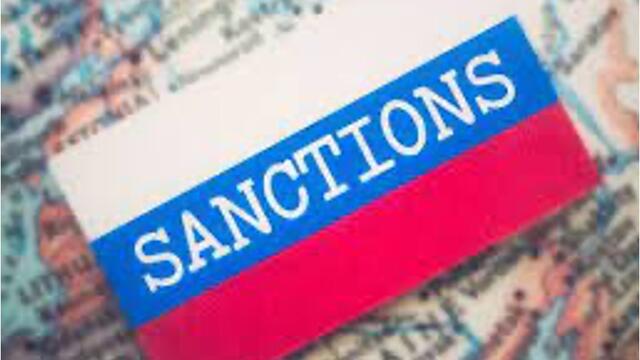 image of the word Sanction written in white on a striped red, white and blue background