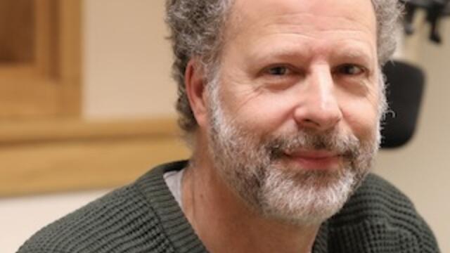 image of Eric Zolov wearing a green sweater