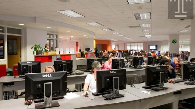 students working at computers it the tech center