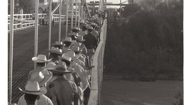 workers crossing a bridge