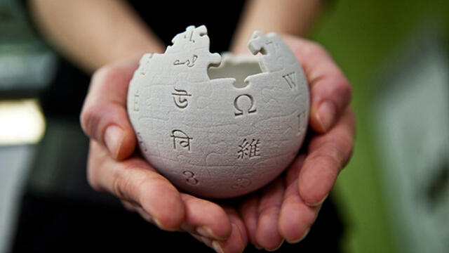 hands holding a ball