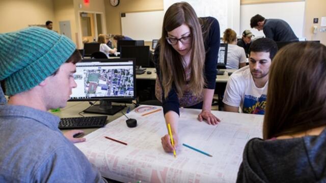 A group of students working on a design.