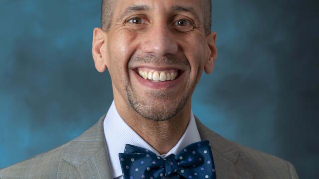 Image of Jermaine F. Williams in front of a blue background