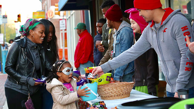 A girl accepting candy.