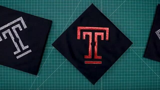 A graduation cap bedazzled with a Temple