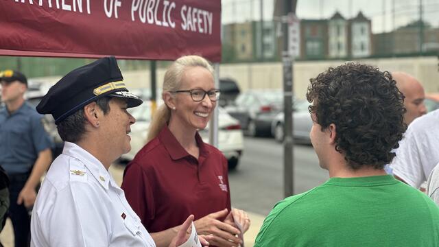 Image of Vice President of Public Safey Jennifer Griffin (center) and Executive Deputy Operations Denise Wilhelm speak with students at the Welcome Wagon on Tuesday