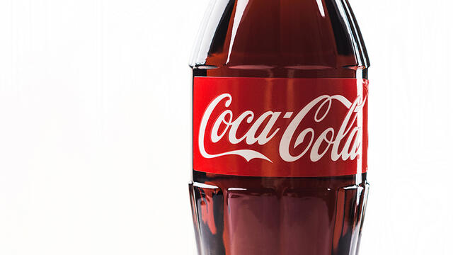 A plastic bottle featuring the iconic red and white Coca-Cola logo.