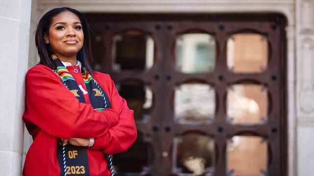Lauren Ross leaning against a building