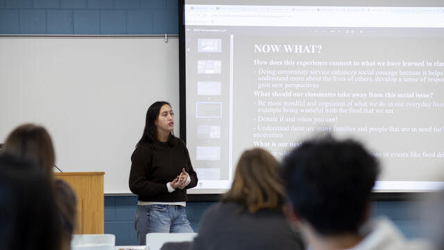 A student presents to their REACT class