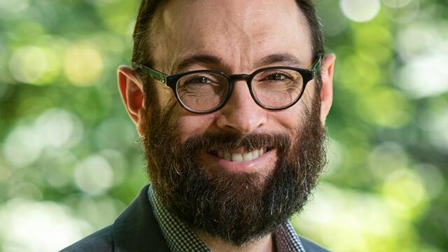 Sam Lebovic smiling at the camera