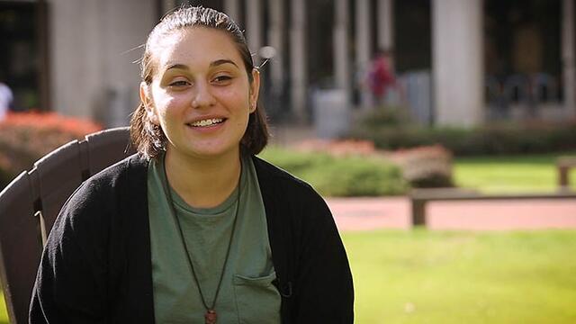 Nadia Vanessa Toro sitting with Paley Library in the background.