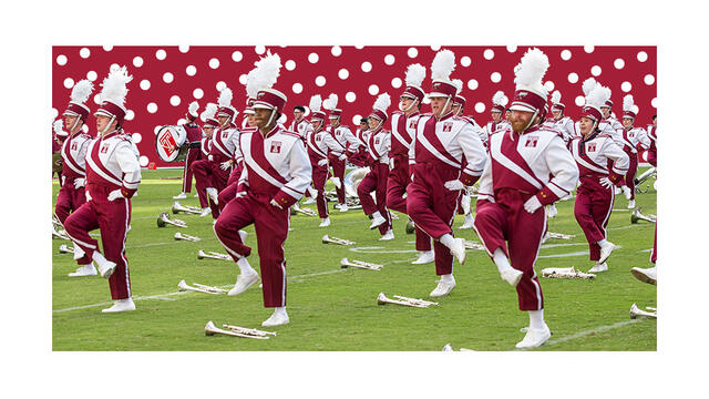 An animated image of the Diamond Marching Band dancing on a football field.