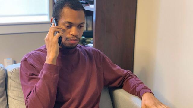 A Temple student volunteer calls a patient in hospital.