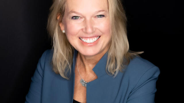 A headshot of Sheri Lambert