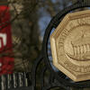gate with Temple seal with Temple flag in background