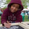 A child plays outside at Temple s Earth Fest.
