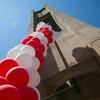Cherry and white balloons decorating the bell tower.