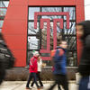 Students walking in front of a Temple T .
