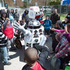 children smiling as they watch a robot at Temple Ambler EarthFest.
