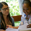 A student receiving guidance from a Temple employee.