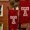 Four Temple T flags on Main Campus.