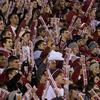 Crowds cheering at a Temple University football game.