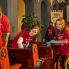 Student volunteers clean pews inside the Berean church.