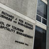 A sign for Temple's School of Tourism and Hospitality Management, which will be renamed.