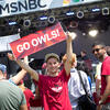 Temple students on an MSNBC set with banners and Temple t-shirts.