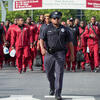 a Temple University police officer escorting football players as they walk into Lincoln Financial Field.
