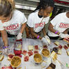 Temple students making peanut butter and jelly sandwiches